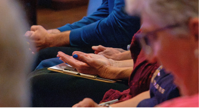 People praying in adoration.