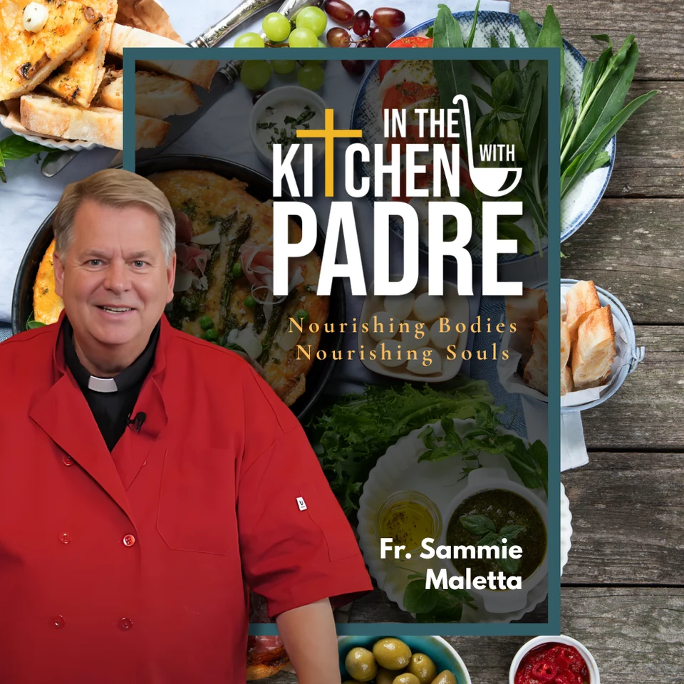 In the Kitchen with Padre cookbook cover featuring Fr. Sammie in a red chef’s jacket, surrounded by food